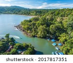 Bahia Drake, Peninsula de Osa, Puntarenas, Costa Rica - Aerial Drone Shot of famous Drake Bay near Corcovado National Park at river mouth with boat dock of Aguila de Osa Rainforest Eco Lodge