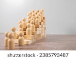 Small photo of Time is money idea. time concept with business man trying to outrun time. Make things better - Improvement Concept. wooden figure - man climbing the steps to success in image over white background