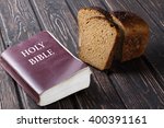 Bible And Bread On A Wooden...