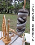 Small photo of Wool on old fashioned spinning wheel at Fort Frederica