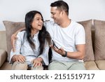 portrait of young couple at home indoor spending good time