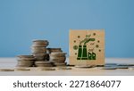 Small photo of Concept of green Co2 Tax.Carbon tax, environmental and social responsibility business concept. Taxation for nature pollution.Wooden cubes with CO2 TAX word and stack coin.