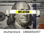 Torn bills revealing Inflation words. Idea for FED consider interest rate hike, world economics and inflation control, US dollar inflation