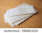 Small photo of Pile of used punched cards on desk containing fortran program