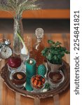 Small photo of Haft Seen traditional table of Nowruz. Persian new year decoration,Tabletop with Haft-seen elements for Novruz, Cultural feast.Traditional celebration of spring in March, Novruz Holiday.
