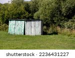 Two Wooden Sheds. In The...