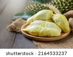 Small photo of Long Laplae Durian on wood plate,It is the most expensive and most delicious of all durians. Rare durian in Uttaradit, Thailand