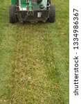 Small photo of Slit seeding fescue lawn turf with power slice/slit seeder
