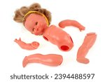 Small photo of Vannes, France, may 3, 2023 : Child abuse concept with a disjointed doll on white background