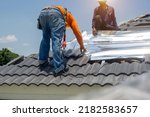 Roof Repair  Worker Replacing...