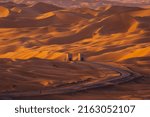 Small photo of Road in The Liwa Oasis, a large oasis area in the Western Region of the Emirate of Abu Dhabi, the United Arab Emirates.