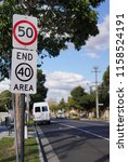 Small photo of Oakleigh, VIC / Australia - Aug 17 2018: 50 km per hour limit sign and end of 40 area sign on a quiet urban street