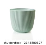 Empty flower pot isolated on a white background. Decorative plant pot cutout. Greenish gray plastic container for growing indoor plants. Vertical striped planter for interior design. Front view.