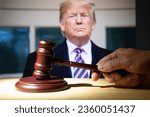 Small photo of Syktyvkar, Komi, Russia, August 26, 2023, Trump and the court session. The judicial hammer on the background of Trump.