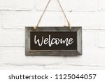 Chalkboard sign board with text welcome come in