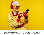Small photo of Happy and funny cool old lady with fashionable clothes portrait on colored background - Youthful grandmother with extravagant style, concepts about lifestyle, seniority and elderly people