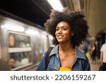 Happy and beautiful african american woman smiling. Pretty young female walking and having fun in New York city