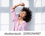 Beautiful latino young woman at home - Pretty south american adult female with curly hair  portrait, lifestyle and domestic life scene