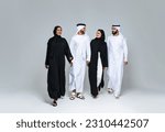 Small photo of Beautiful arab middle-eastern women with traditional abaya dress and middle easter man wearing kandora in studio - Group of arabic muslim adults portrait in Dubai, United Arab Emirates