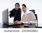 Small photo of Beautiful arab middle-eastern women with traditional abaya dress in studio - Arabic muslim adult female businesswomen working together in the office in Dubai, United Arab Emirates