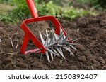 Small photo of Cultivator effective manual tool for tillage. loosening bed