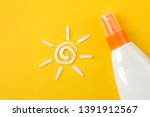 Small photo of sunscreen remedy. various sunscreens and sun cream on a bright yellow background. Sun protection. Ultraviolet protection. Summer. top view.