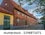 Small photo of Ystad, Sweden - 6 Sep, 2022: Old half timbered building that houses smaller businesses in a smaller town, southern Sweden.
