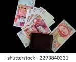 money English pounds lie on a black background