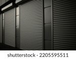 Small photo of Closed shop. Steel blinds. Blinds on office windows. Ribbed surface.