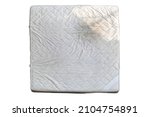 Small photo of Old mattress is dried in the sun to kill germs isolated on white background included clipping path.