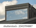 Small photo of Dormer window in a family home with a wide panoramic window