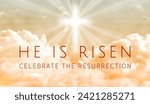 Small photo of Easter illustration with the text 'He is Risen' and a shining cross on orange color sky with lightbeam.
