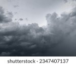 Small photo of Atmosphere of overcast sky before to rainy.Dusk overcast sky in rainy season. Dark cloudy against white sky. Rain cloudy floating on sky frame. Copy space for text or word to do background work.