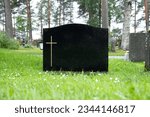 Blank black colored gravestone...