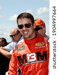 Small photo of Long Pond, PA, USA - July 29, 2018: NASCAR driver Timmy Hill awaits the start of the 2018 NASCAR Gander Outdoors 400 at Pocono Raceway in Pennsylvania.