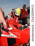 Small photo of Speedway, IN, USA - May 22, 2014: Race driver Gabby Chaves prepares to compete in an Indy Lights Series event at Indianapolis Motor Speedway.