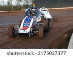 Small photo of New Egypt, NJ, USA - April 30, 2022: Race driver Al Cheney leads Mick D'Agostino in a Sprint Car race at New Egypt Speedway in New Jersey. Slightly blurred to depict action.