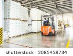 Small photo of Forklift loader for warehouse works outdoors with risen forks