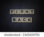 Small photo of Fight Back, word cube with background.