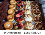Assortment of delicious and colorful dessert, chocolate cake, mixed berry tart, Lemon Meringue Tart, chocolate tart made by pastry chef. All look tasty and delightful. Perfect for party. Natural light