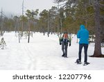 Trekking with snowshoes in the snow