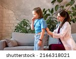 Small photo of Child Girl Suffers from Dry and Wet Cough. Complaint Breathing Discomfort. Auscultation Lungs Exam with Stethoscope. Woman Pediatrician in Pediatric Medical Office with Young Female Patient