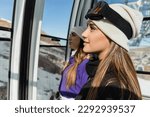 Happy women in ski outfit in cable car