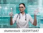 Woman doctor pointing hud futuristic interface. High technology medicine concept