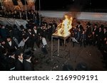Small photo of Manchester, uk. - May 18, 2022: Orthodox Jews celebrating Lag Ba'omer holyday singing and dancing by a bonfire Lag Baomer Rabbi Shimon bar Yochai