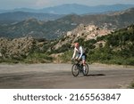Small photo of Speloncato, Corsica, France - 7th June 2022: Maximilien Couvreur competes in the 2022 BikingMan Corsica race as he tackles the 1100m Col de Battaglia above the village of Speloncato