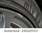 Small photo of Chipped alloy wheels. Chipped abrasion of silver alloy wheels around the edge of the wheel. Repair of car wheels. Wheel truck is abrasion damage.