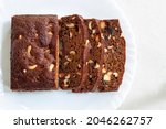 Small photo of Plum cake cut pieces sliced slice in white background baked