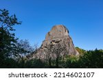 Small photo of Cave in the rock of the Holy Spirit near Roussanou Monastery, formerly used to confine wayward monks. Kalambaka, Meteora, Thessaly district, Greece, Europe. Monk Prison. Clear blue sky on summer day