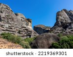 Small photo of Cave in the rock of the Holy Spirit near Roussanou Monastery, formerly used to confine wayward monks. Kalambaka, Meteora, Thessaly district, Greece, Europe. Monk Prison. Clear blue sky on summer day